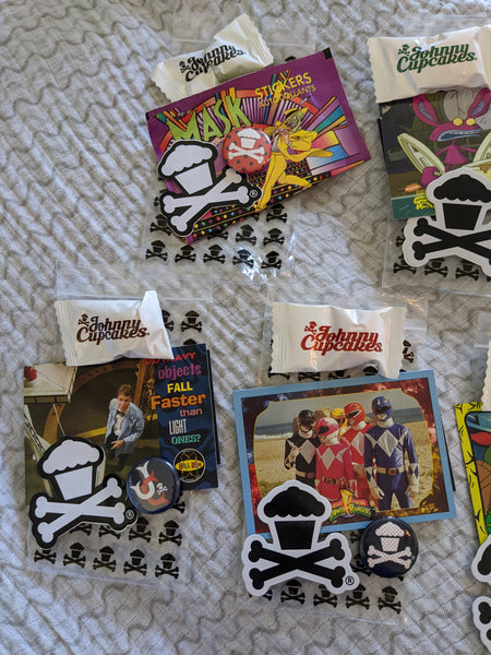 Set of 7 Johnny Cupcakes goody bags: pins, stickers, trading cards