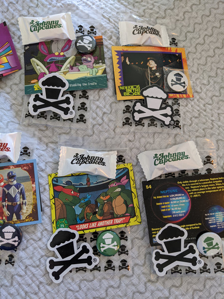 Set of 7 Johnny Cupcakes goody bags: pins, stickers, trading cards