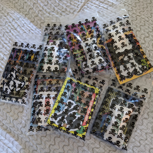 Set of 7 Johnny Cupcakes goody bags: pins, stickers, trading cards